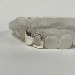 Two teeth in Stg Silver, one full cap, one open window