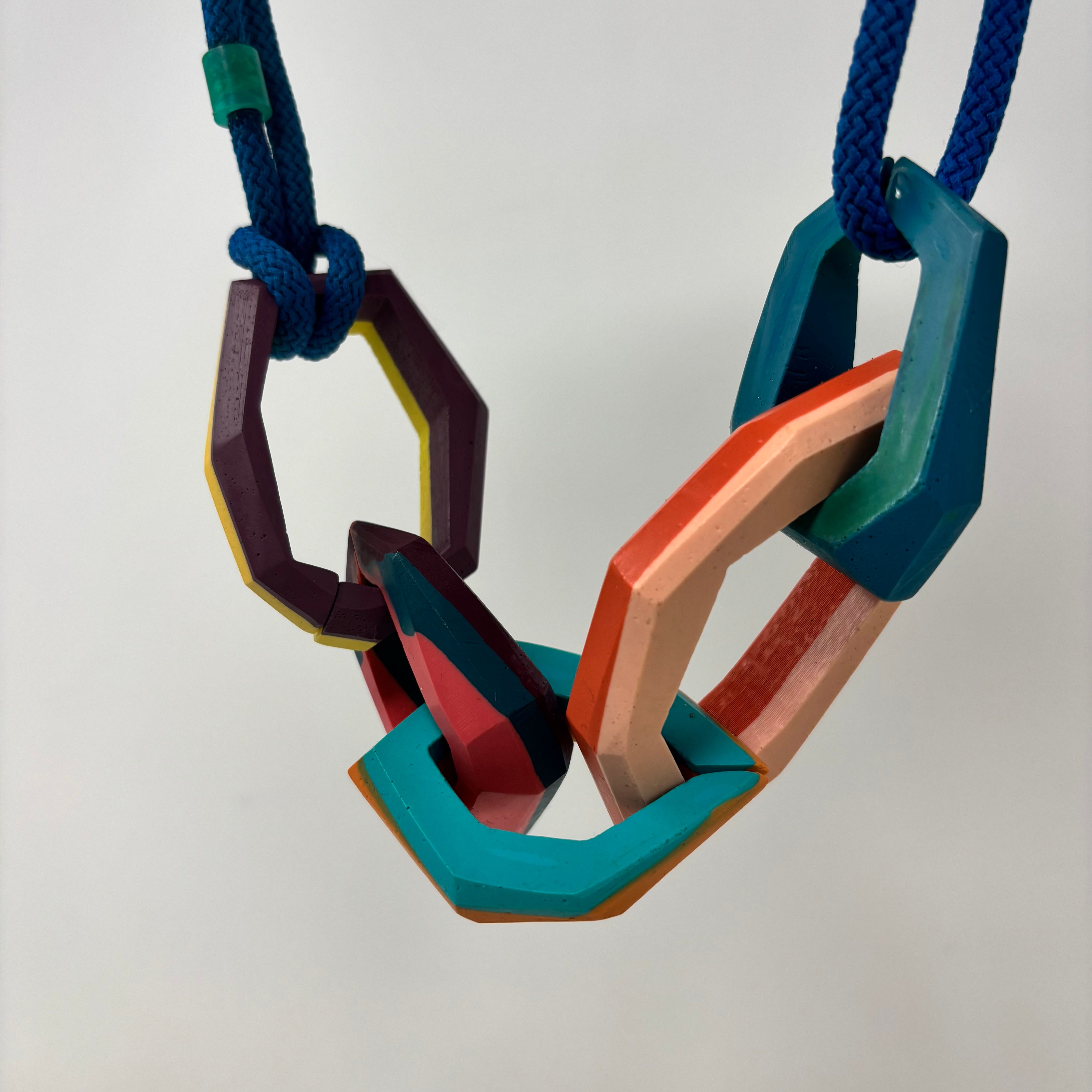 Links Necklace, 5 multicolour links on a teal cord