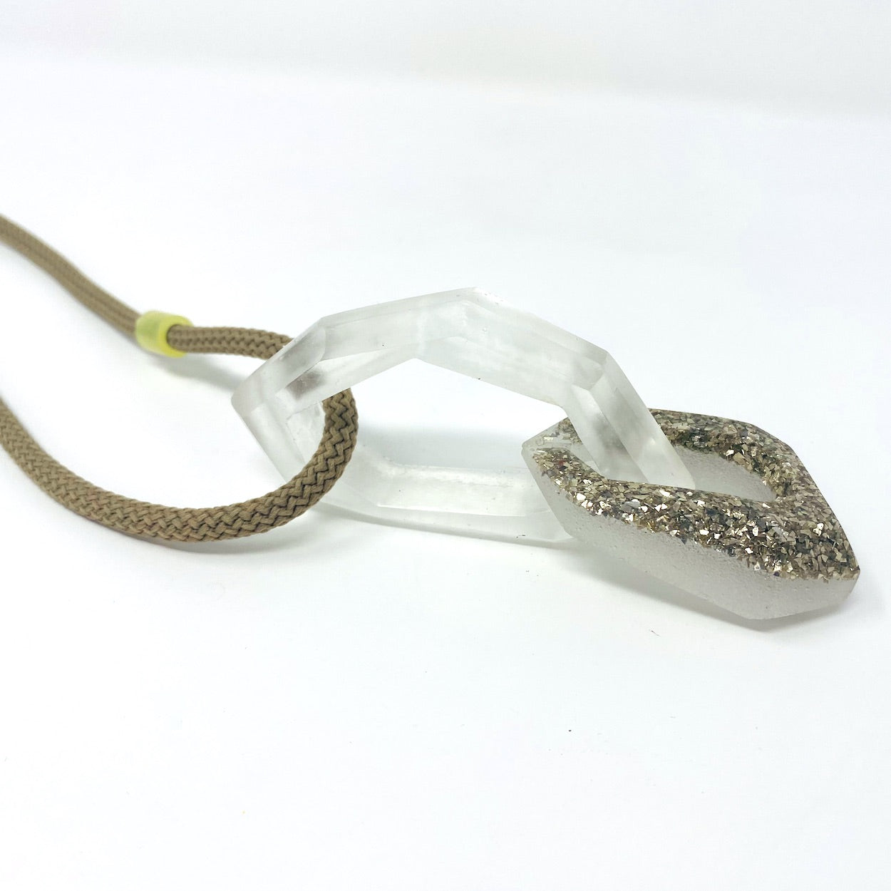 Maca Links Pendant. Clear and Silver Glitter