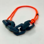 Load image into Gallery viewer, Maca Links Necklace, charcoal and fluro orange
